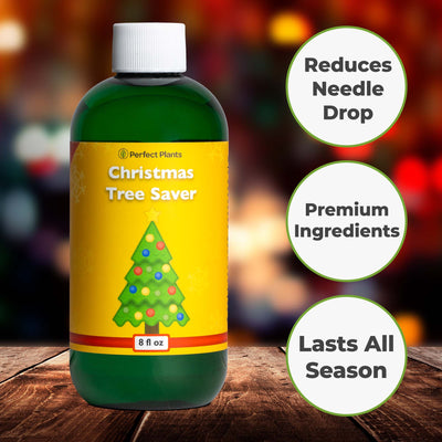 Bottle of Christmas Tree Saver on a wooden surface with festive lights in the background showing three main points for the product including reduces needle drop, premium ingredients, and lasts all season