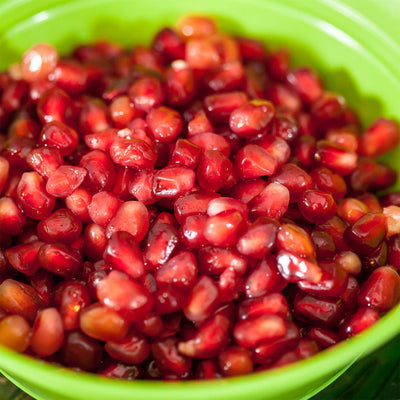 Russian Pomegranate arils in a green bowl