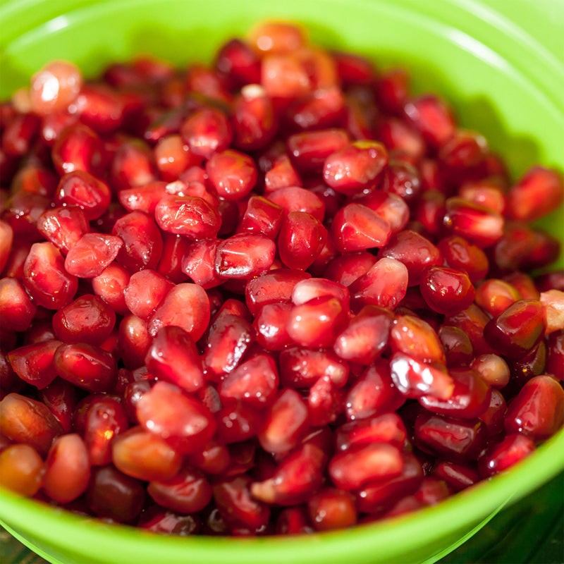Russian Pomegranate arils in a green bowl